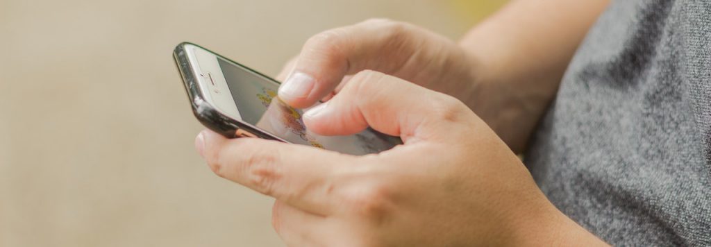 Close up of someone using a phone